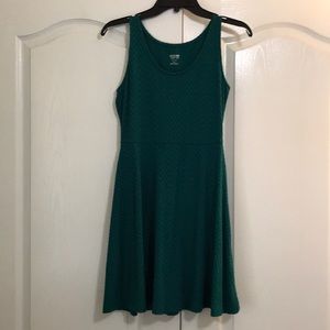 Teal fit and flare dress with chevron pattern.